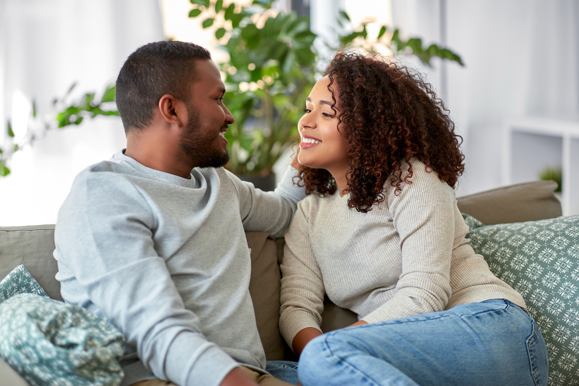 Romantic Couple Talking on the Sofa